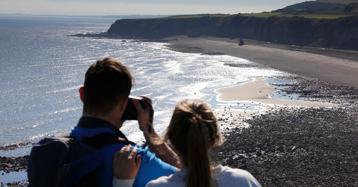 couple overlooking Nose's Point on the Durham Heritage Coast